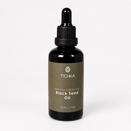 A 50 mL bottle of Tichka Black Seed Oil with a black dropper cap and a brown label, set against a plain white background.