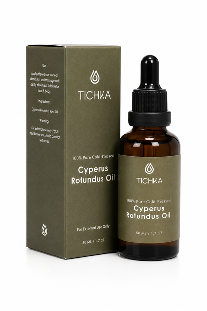 A bottle of Tichka Cypress Rolundus Oil next to its matching olive green box packaging, displayed on a clean white background.