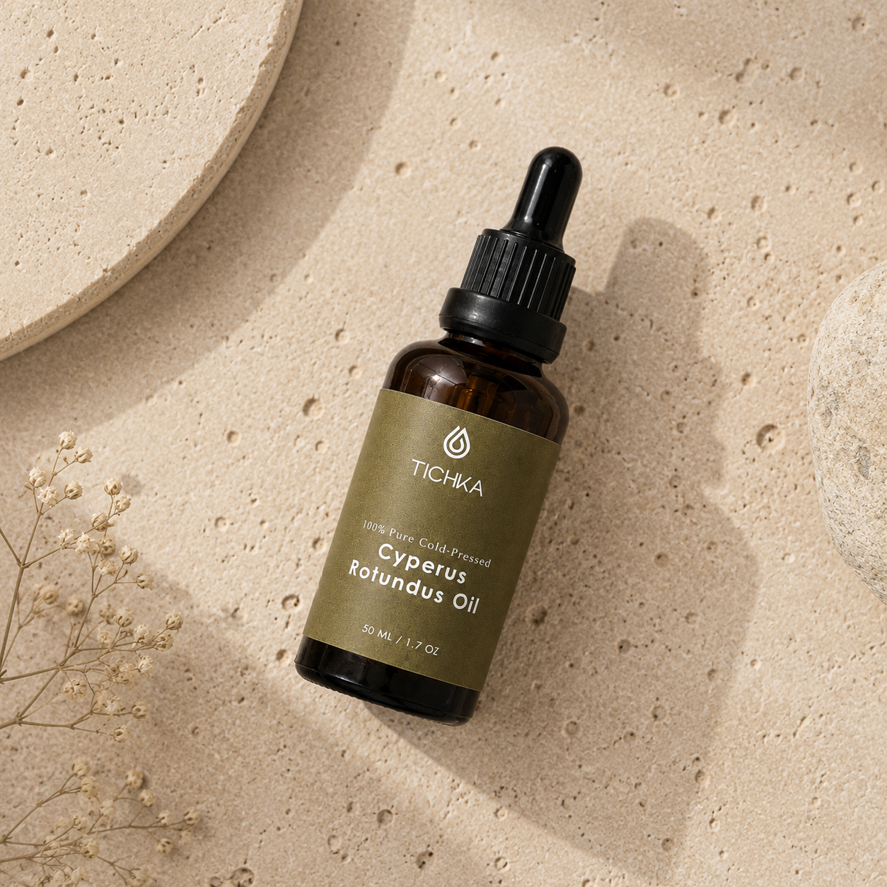 A bottle of TICHKA Cyperus Rotundus Oil on stone background