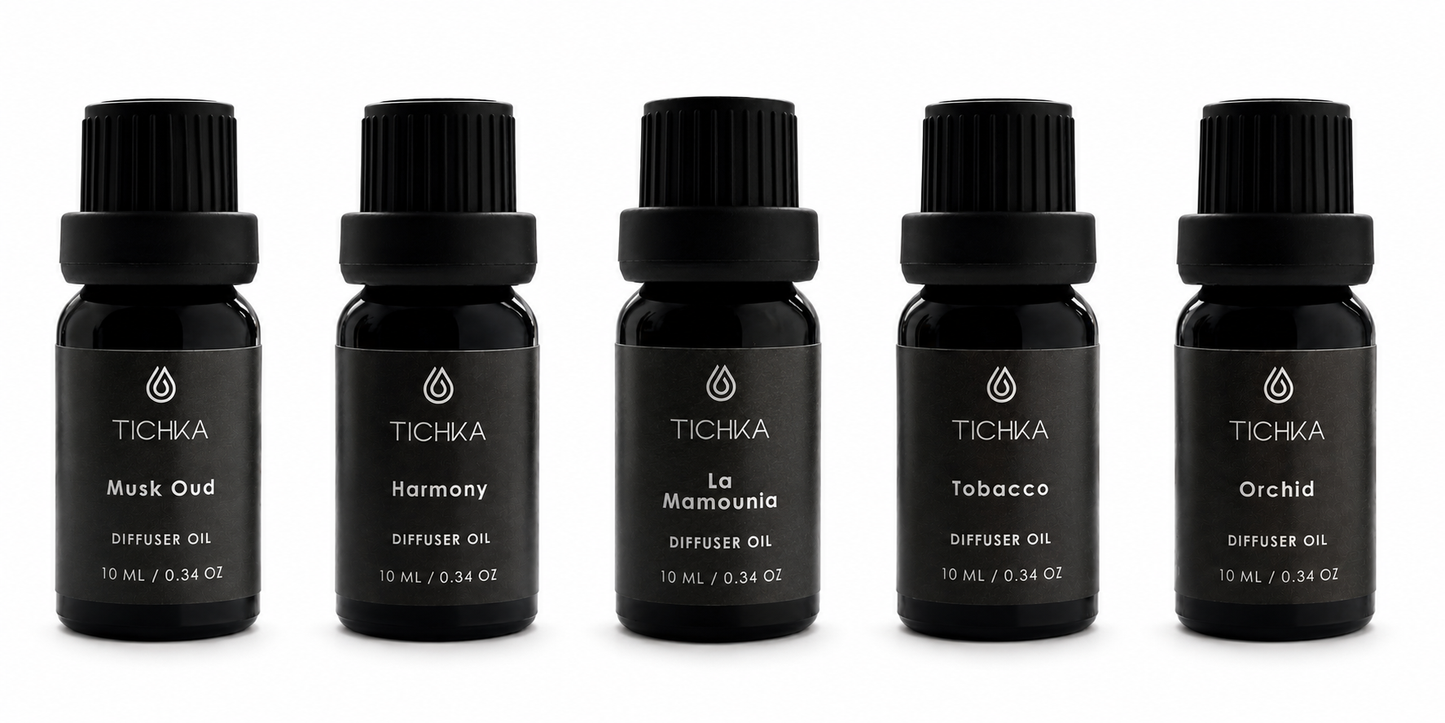 Set of five TICHKA diffuser oil bottles on a white background