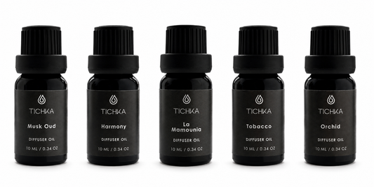 Set of five TICHKA diffuser oil bottles on a white background