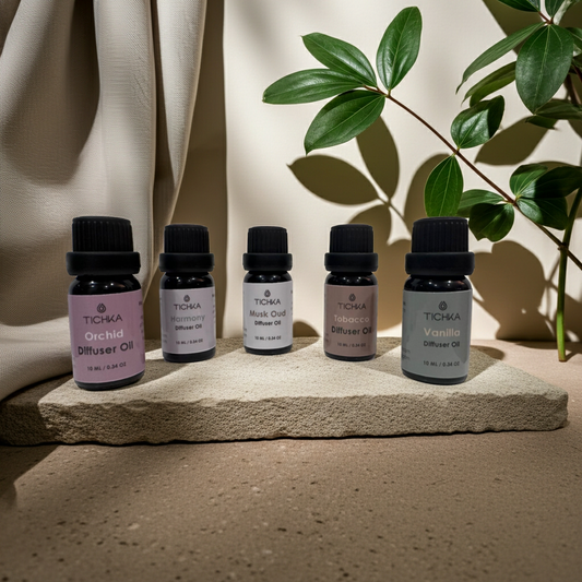 Set of Tichka diffuser oil bottles on a stone surface with a plant in the background